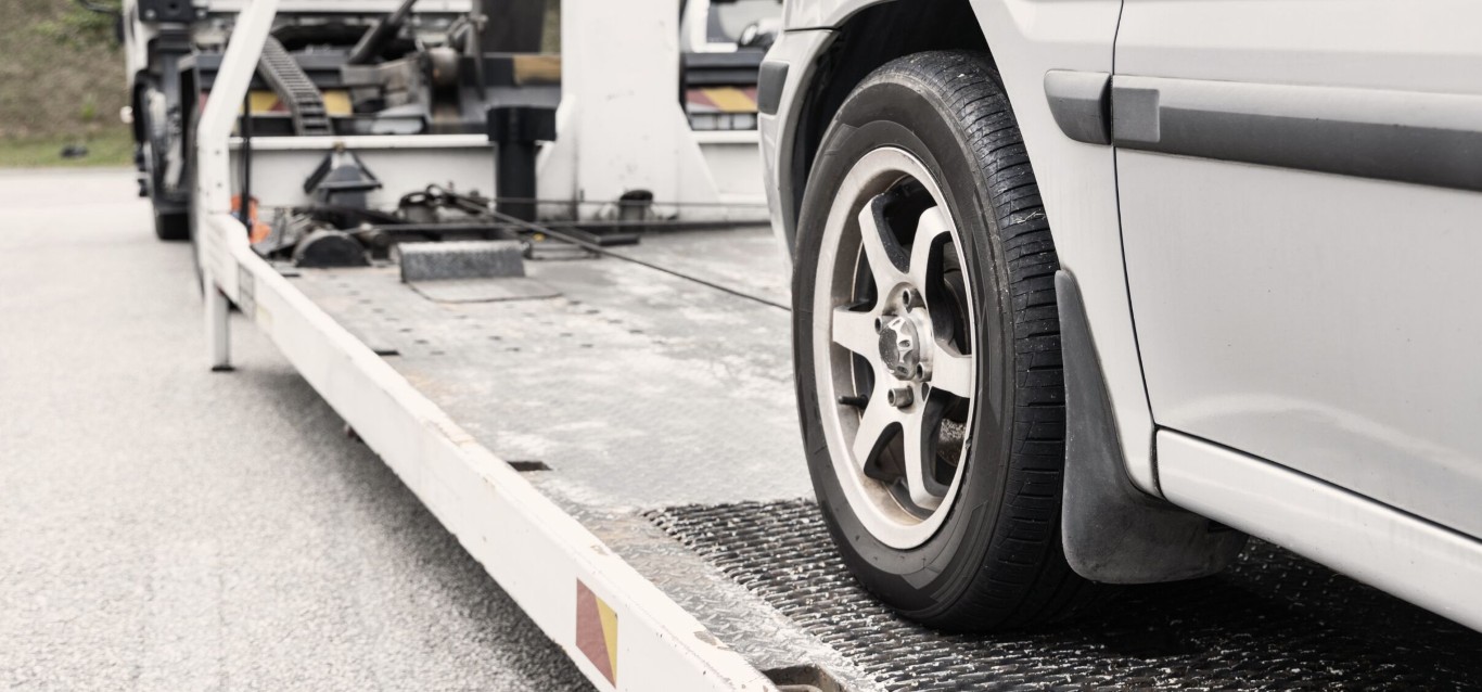 Flatbed towing service protecting vehicles during transport in Woodridge, IL