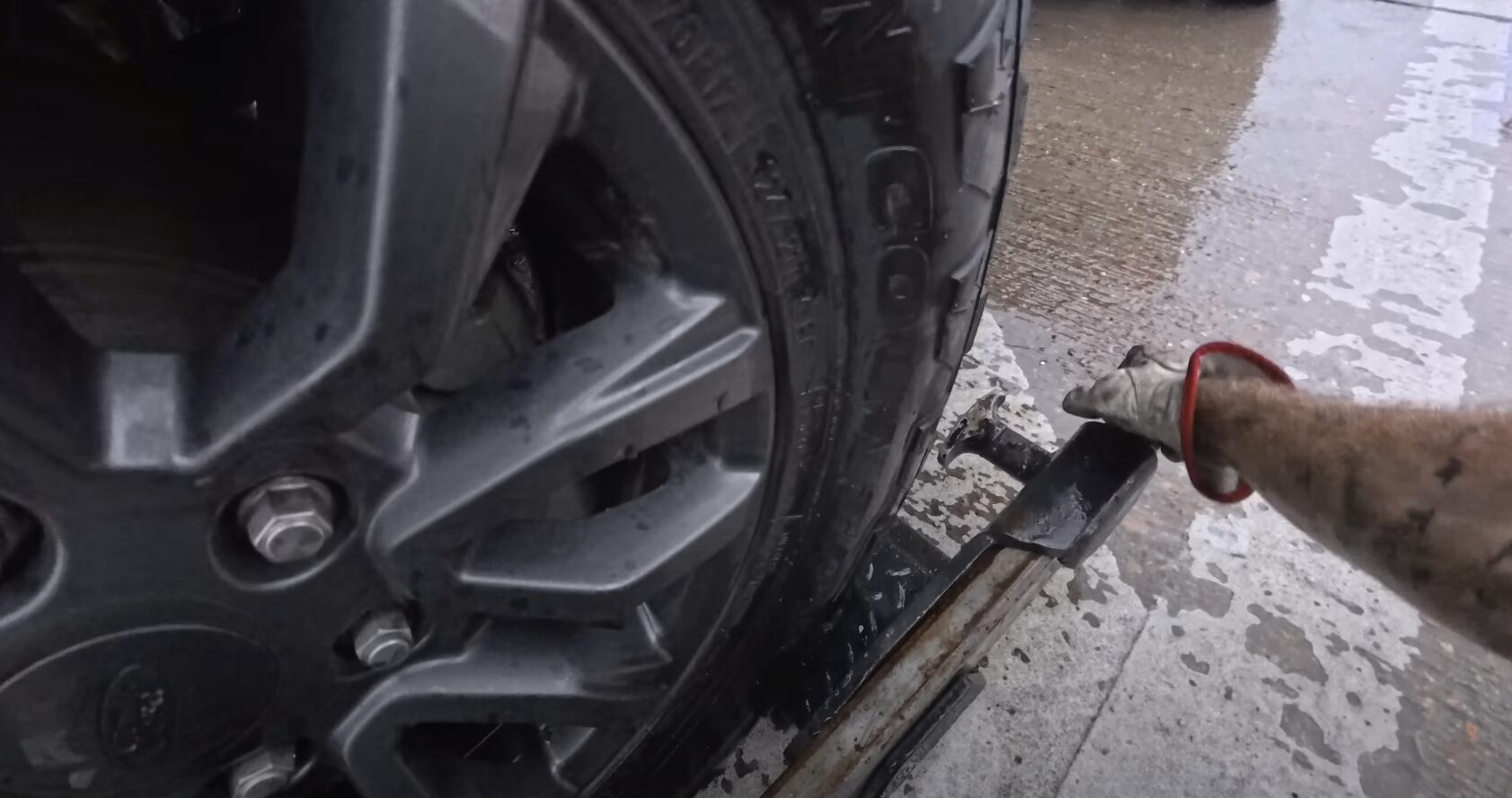 Expert towing service providing professional roadside assistance Professional tow truck operator connecting vehicle for safe roadside assistance and towing